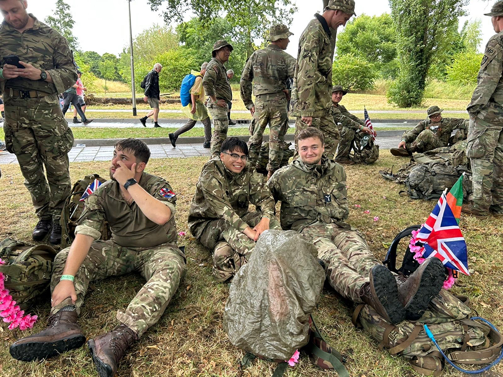 During the walk, team members rest with other groups of walkers around them.